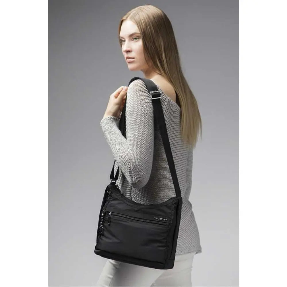 Exterior zippered pocket with open slip pocket