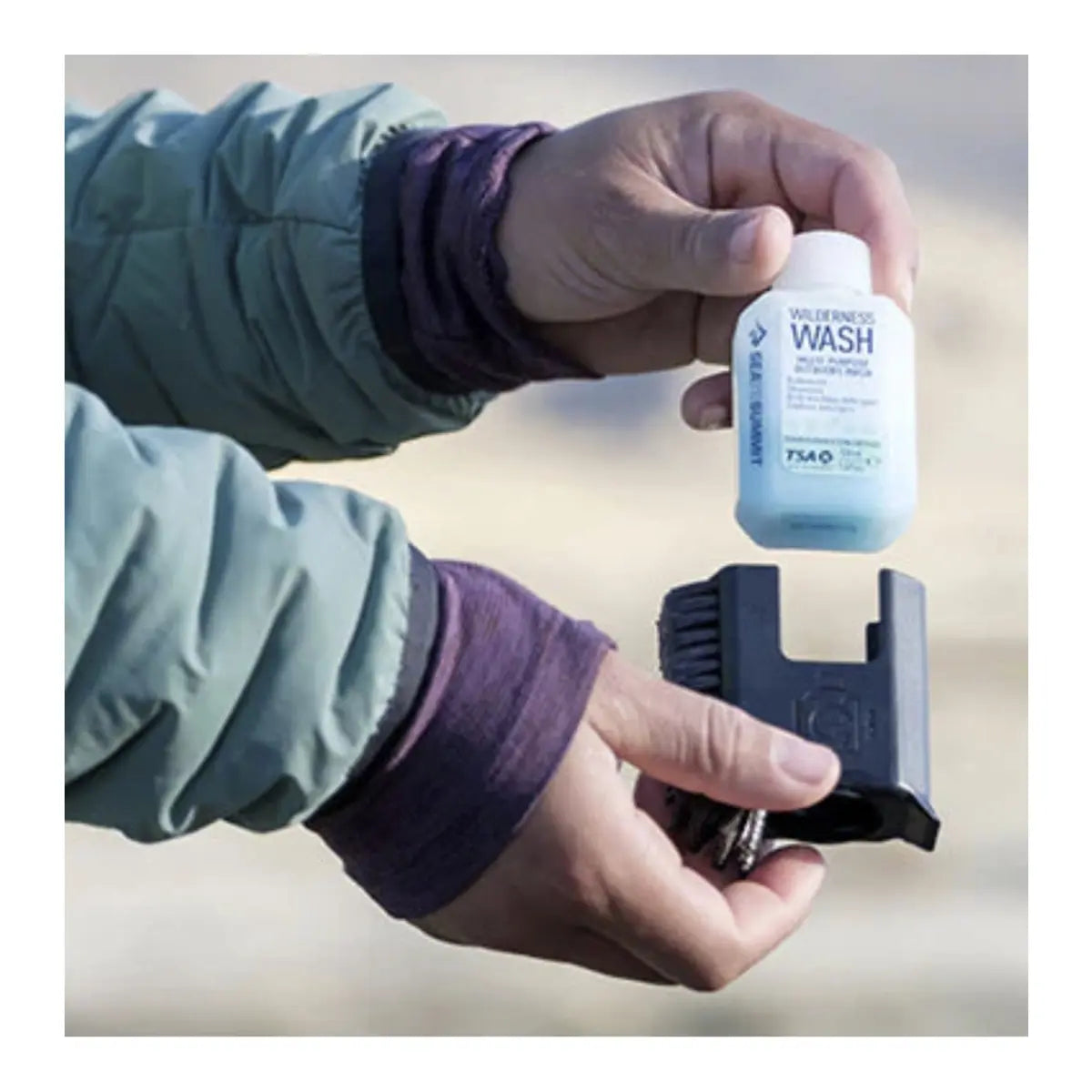 Pocket-sized convenience: Pot Scrubber and integrated 50ml bottle of Wilderness Wash fit in the palm of your hand