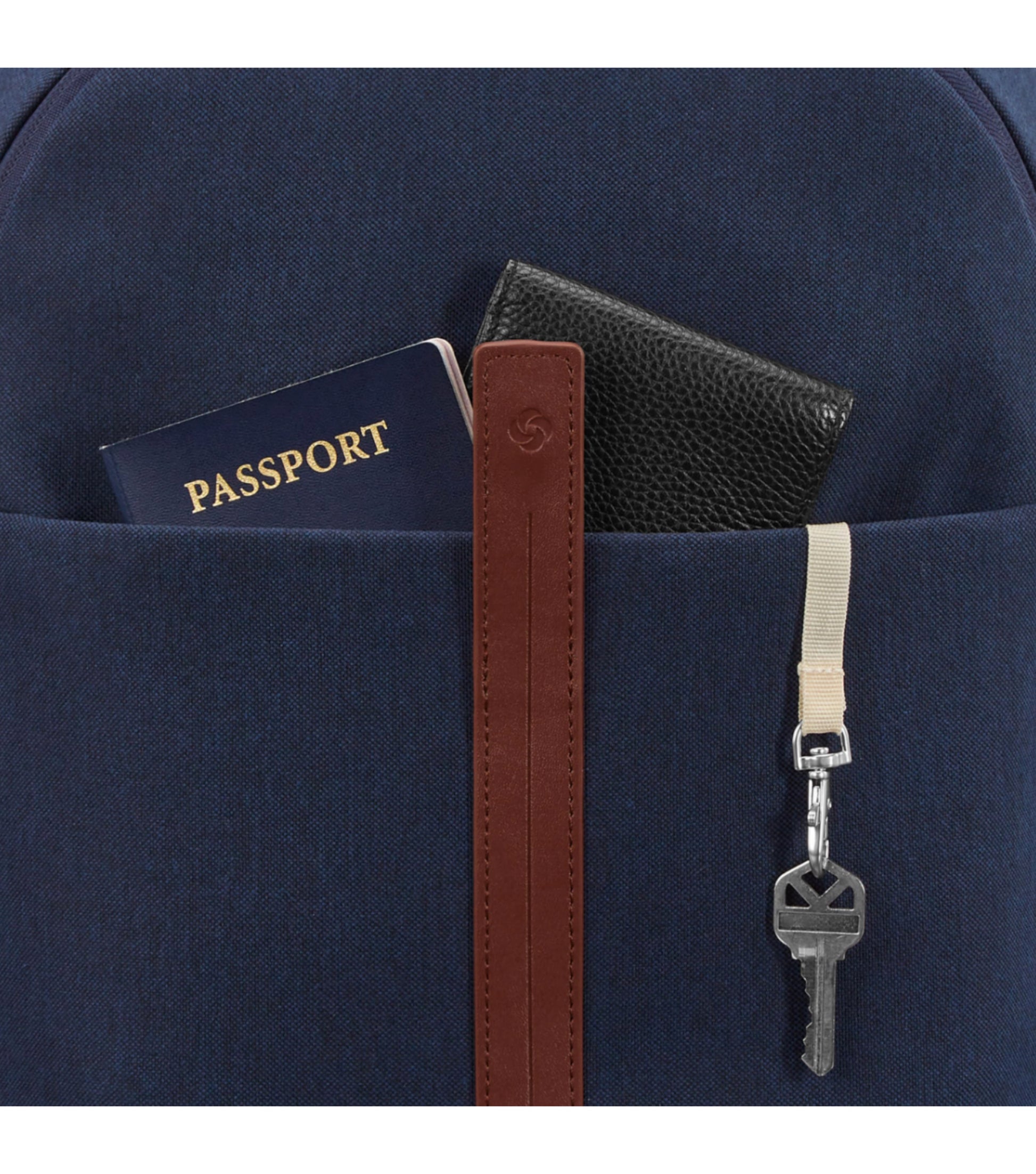 Exterior features front pocket and key fob with magnetic snap and zip closures