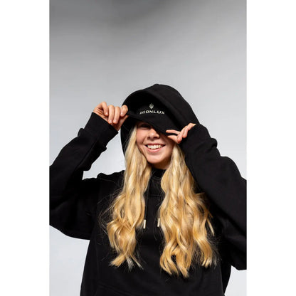 Person wearing a black travel hoodie with built in eye mask