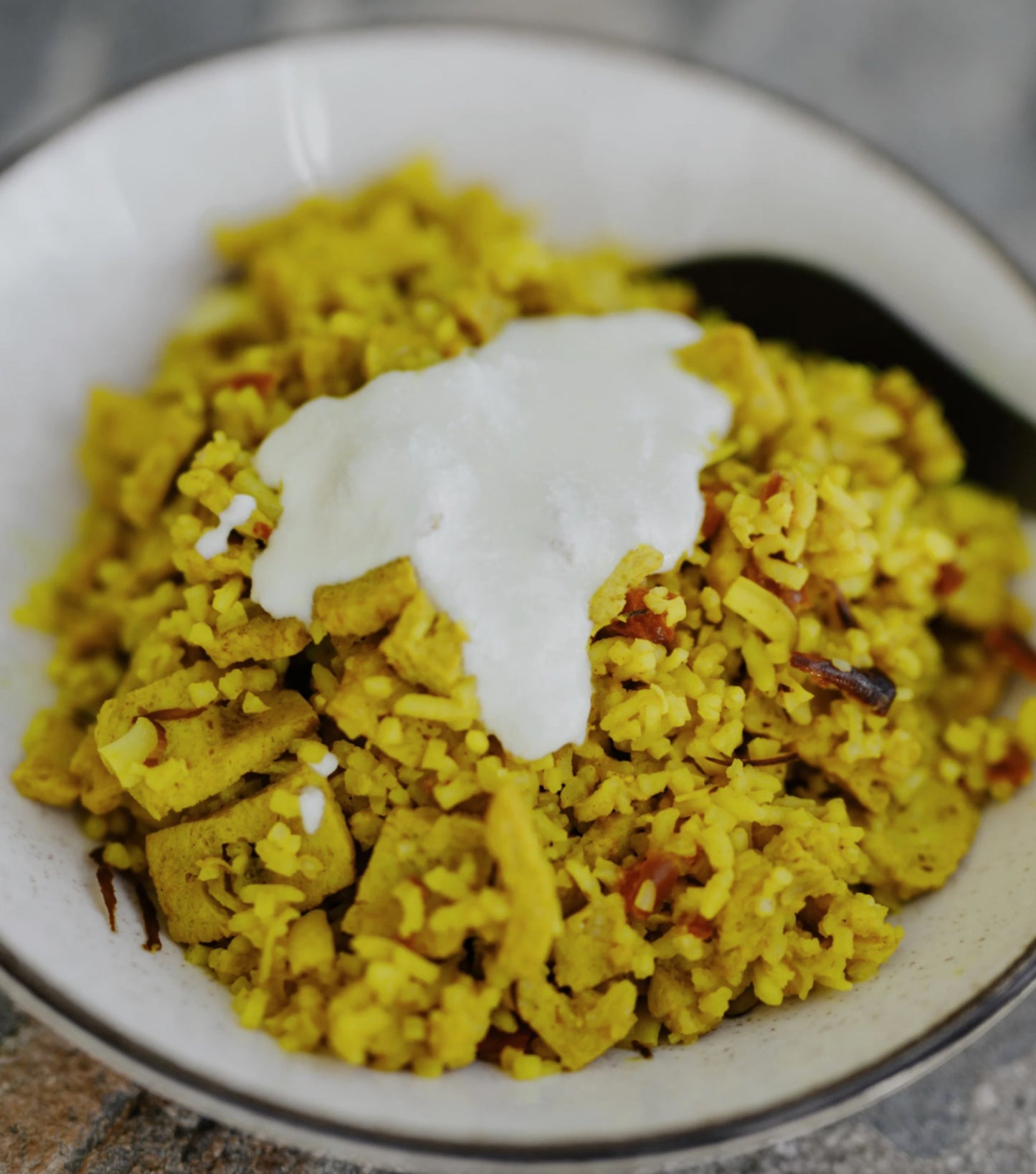 authentic spicy rice and freeze-dried chicken with vegetables, almond flakes and a yoghurt sauce to mix