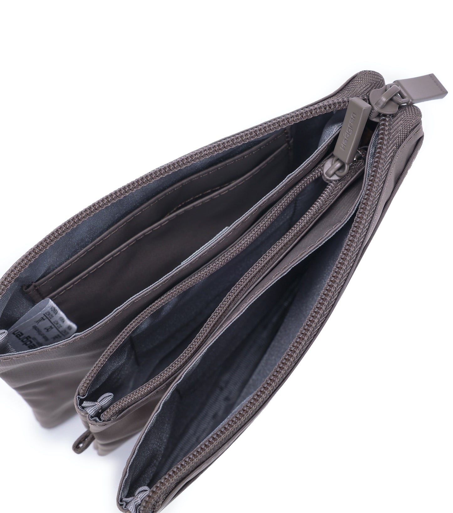 Unzip the main zipper to reveal three separate compartments for storage