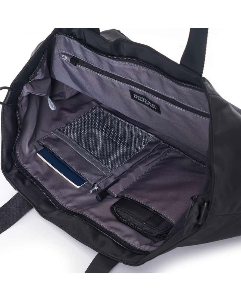 Main compartment has RFID blocking zippered pocket, 2 open slip pockets, pen loops