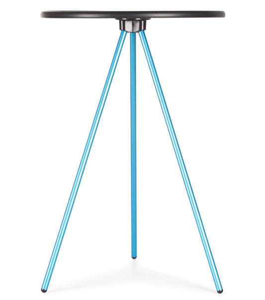 Tripod style camp table with a circular hard surface top