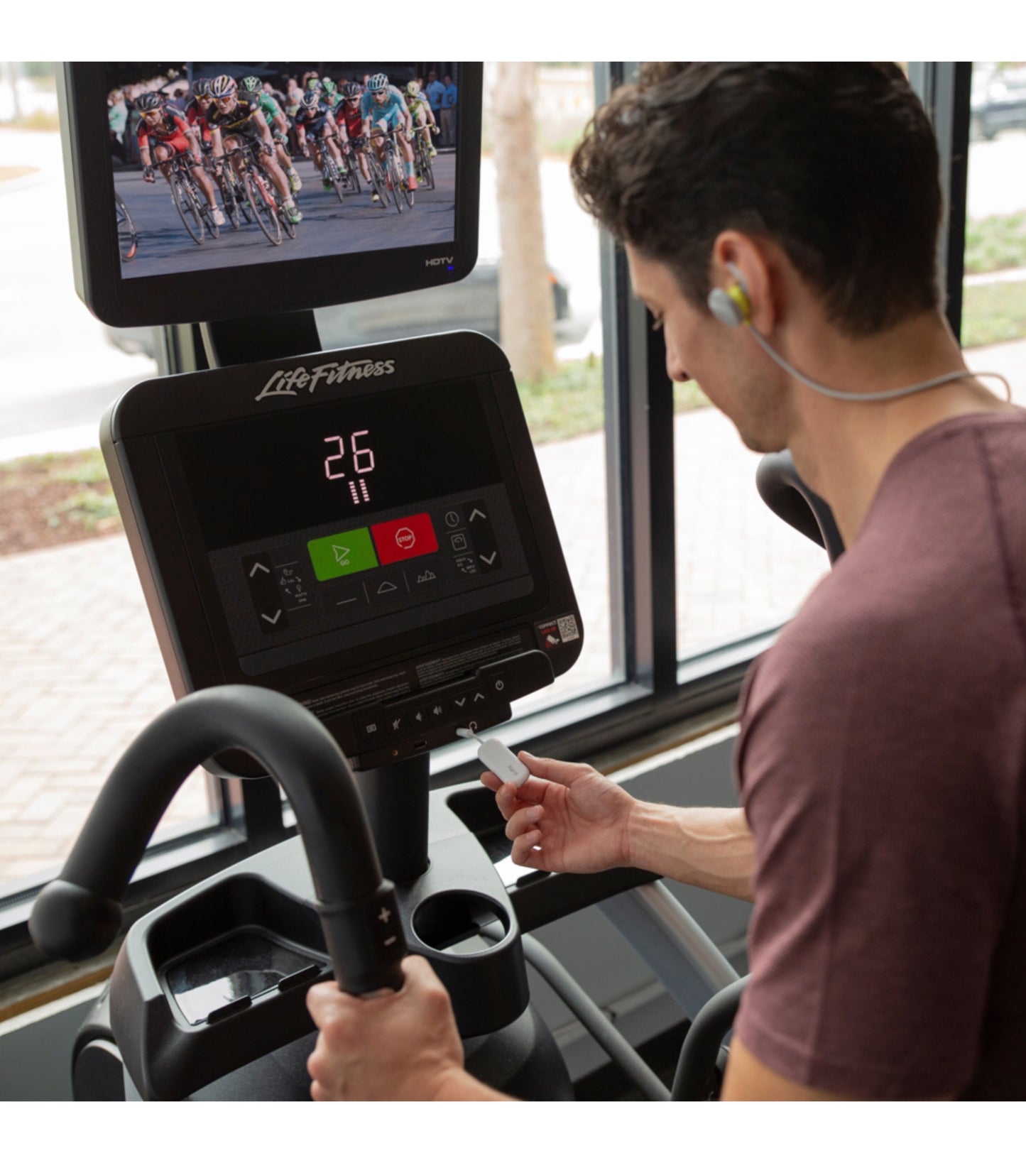 Plug this tiny transmitter into a headphone jack to listen to the TVs at the gym