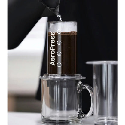 First, water is poured over the coffee, wetting and aerating the grinds