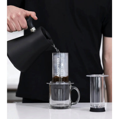 First, water is poured over the coffee, wetting and aerating the grinds