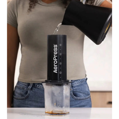 First, water is poured over the coffee, wetting and aerating the grinds