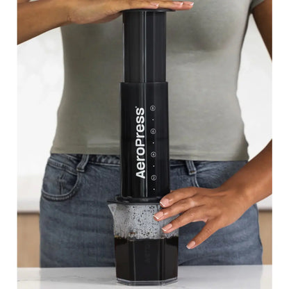 Air pressure quickly pushes the brew through the coffee bed and filter