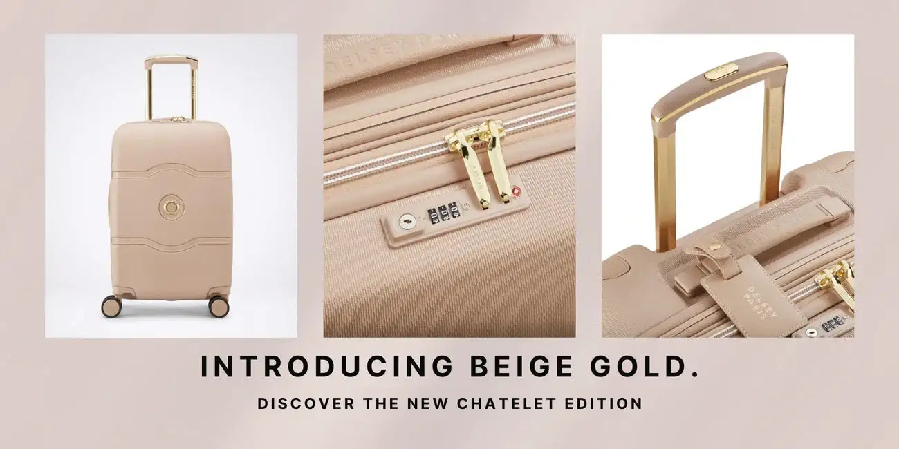 Beige and gold-colored hard-shell suitcase with a sleek, modern design featuring a retractable handle, four wheels, and a combination lock.