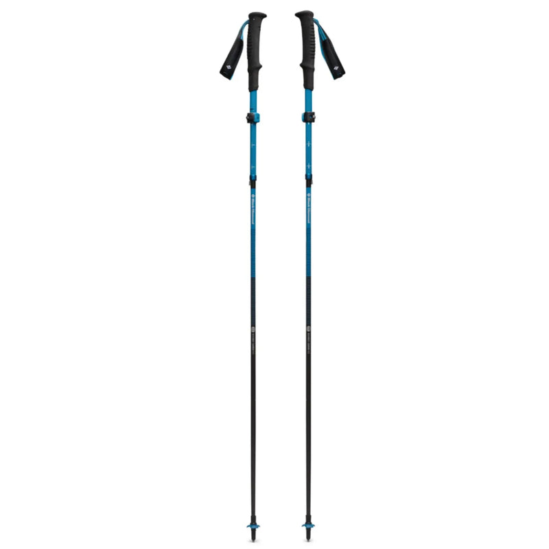 A pair of teal and black adjustable black diamond distance carbon trekking poles with textured grips 110 cm desert sky