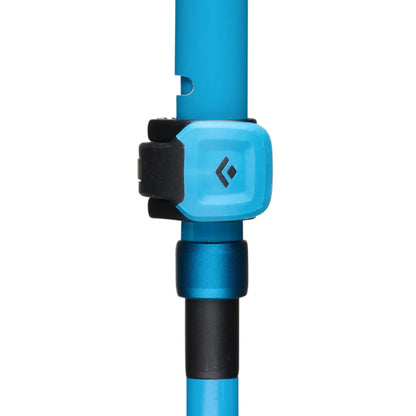 Blue black diamond distance carbon trekking pole with black grip and light blue branded collar in desert sky color