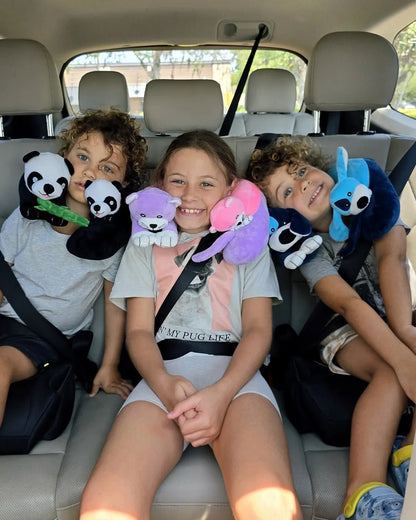 Child wearing the Cabeau Evolution Kids neck pillow in a car