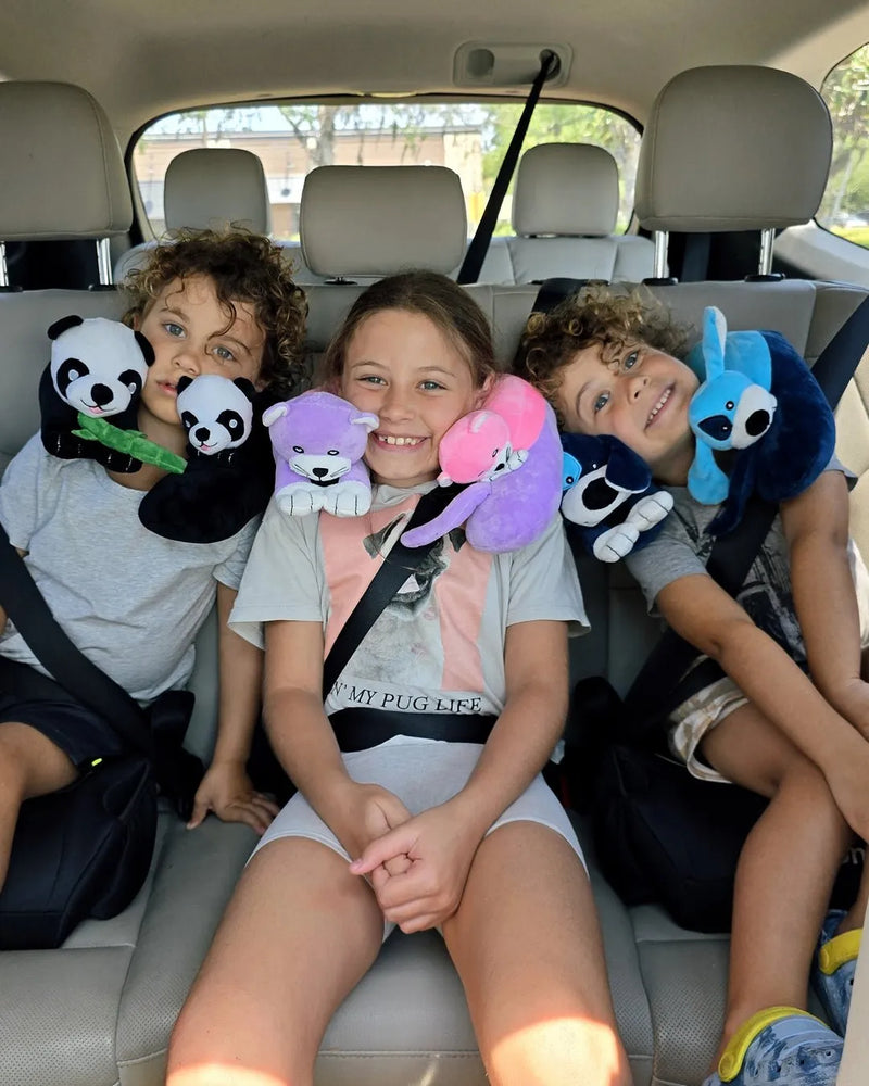 Child wearing the Cabeau Evolution Kids neck pillow in a car