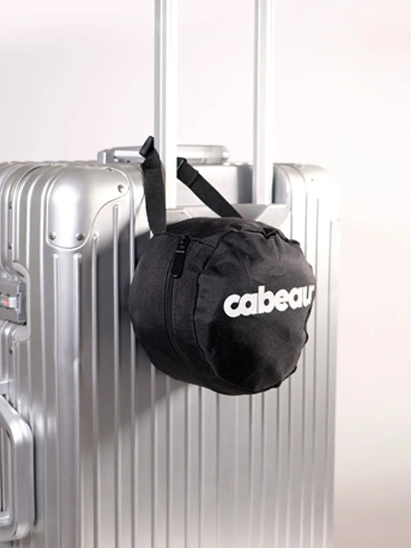Cabeau Evolution S3 travel bag clipped to a suitcase