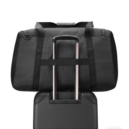 Trolley system compatible allowing the bag to slide over a suitcase handle (sold separately)