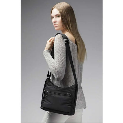 Exterior zippered pocket with open slip pocket