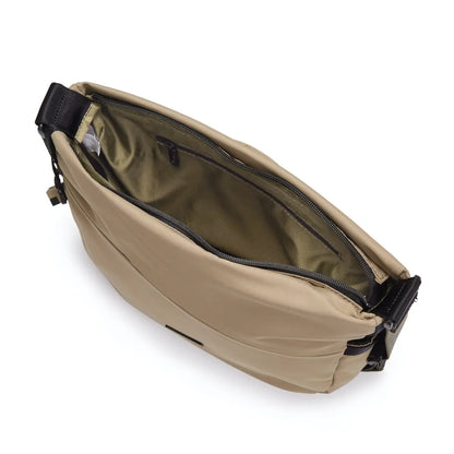 Main compartment has one open pocket and key chain inside