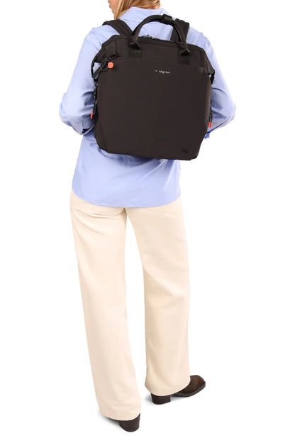 Hedgren ORIZURU 15" Laptop Backpack in Black, worn on both shoulders over a blue shirt, seen from behind