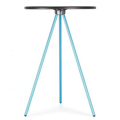 Tripod style camp table with a circular hard surface top