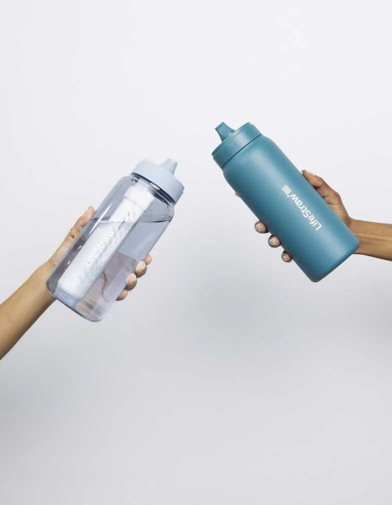 LifeStraw Go 2.0: two LifeStraw Go bottles, light blue and teal, passed between two hands