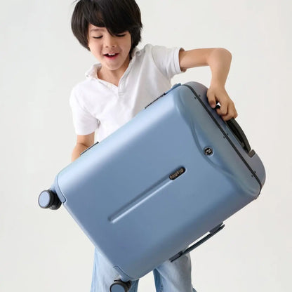 Person holding a MiaMily 48cm ride-on blue suitcase