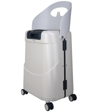 White oxygen concentrator with wheels and handle for easy mobility paired with mist grey miaMily carry on luggage