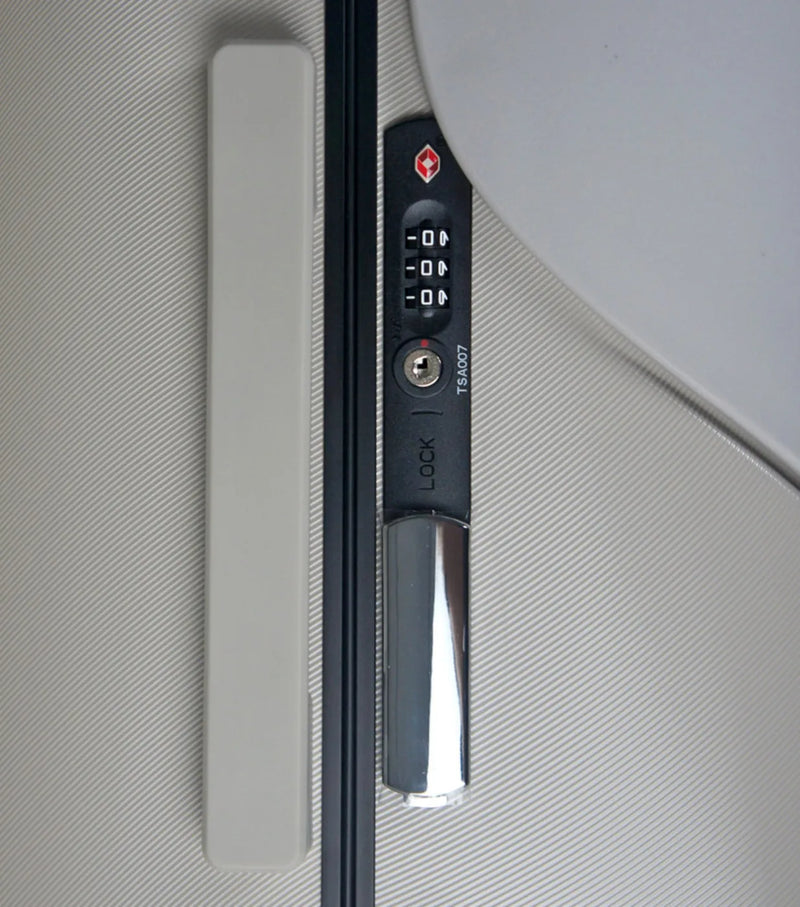 Black and silver digital lock door handle on the mist grey miaMily 48 cm ride-on carry on luggage with portable seat