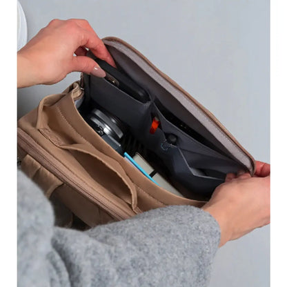 Internal pockets, including a designated phone pocket and pen pocket, allow for easy storage and organisation