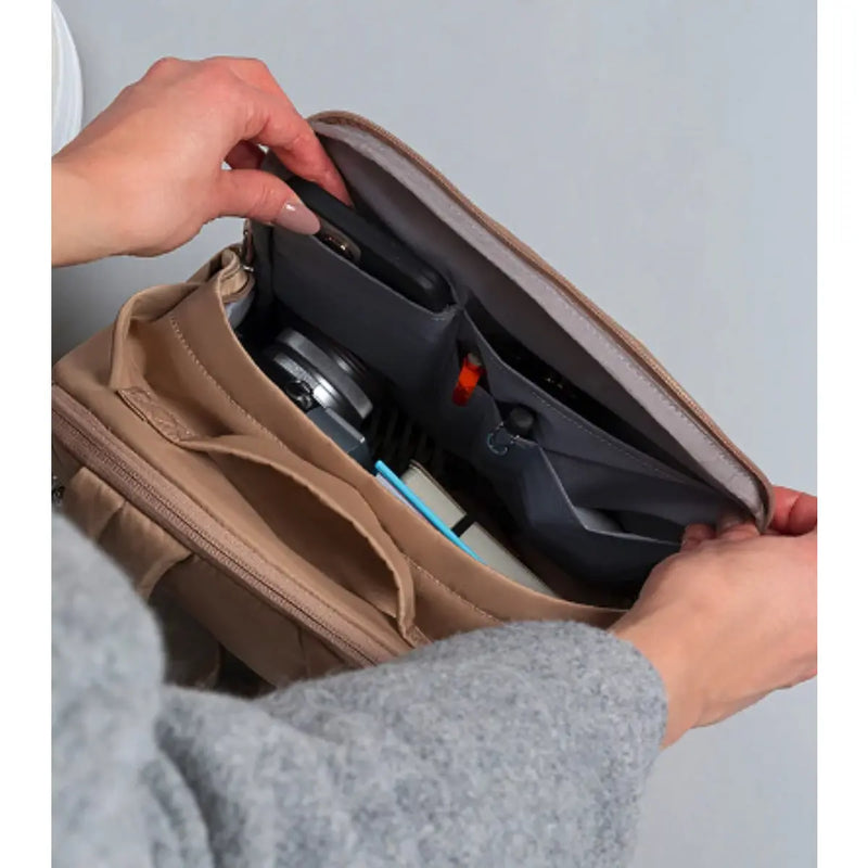 Internal pockets, including a designated phone pocket and pen pocket, allow for easy storage and organisation