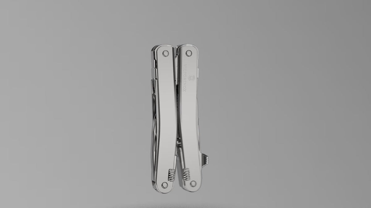 How to attach the carry clip to a Victorinox SwissTool: the clip screwed onto the closed tool with the hex key in a studio