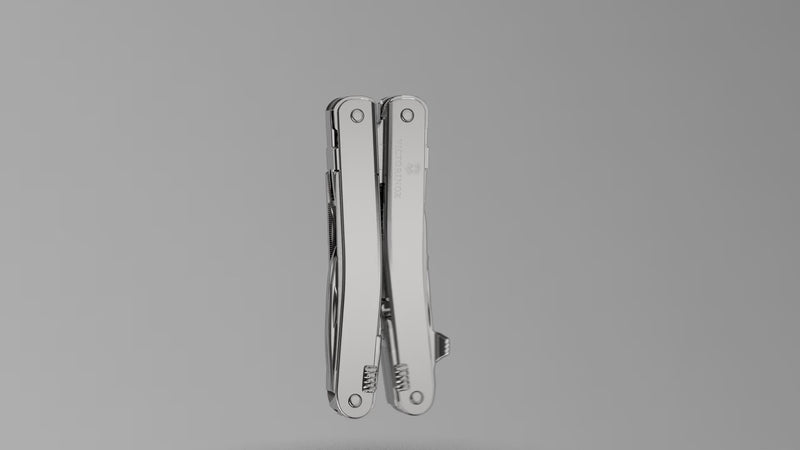 How to attach the carry clip to a Victorinox SwissTool: the clip screwed onto the closed tool with the hex key in a studio