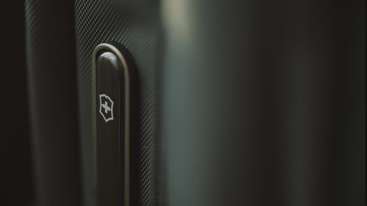 Victorinox Werks Traveler 7.0 boarding backpack in black carried by a traveller from a hotel room into a car, a train and a meeting room