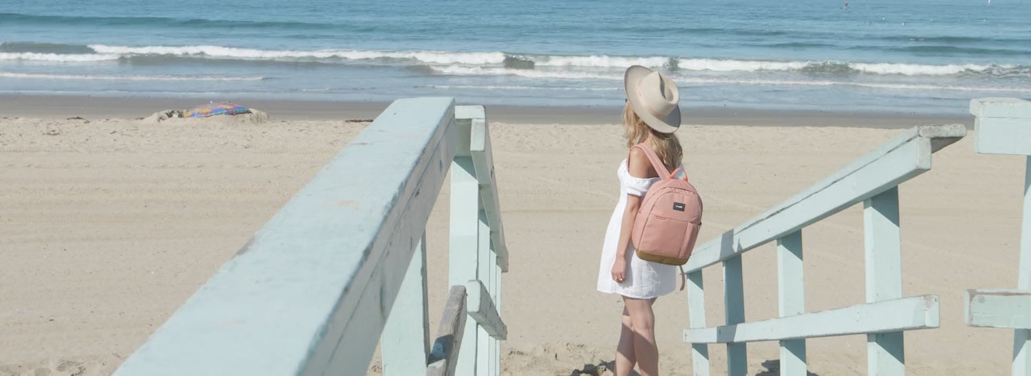 Pacsafe GO backpack and hip pack worn on Venice Beach