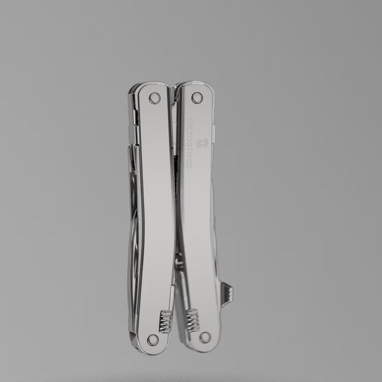 How to attach the carry clip to a Victorinox SwissTool: the clip screwed onto the closed tool with the hex key in a studio