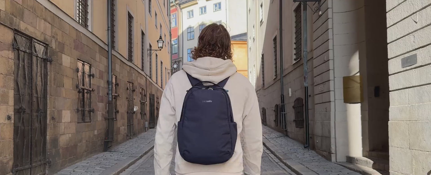 Pacsafe V 16L All-around Backpack worn through a Stockholm old town lane