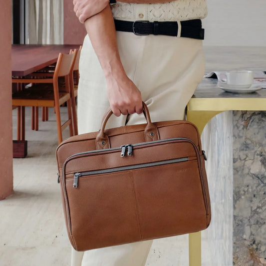 man casually holding a Samsonite Classic Leather Toploader 15.6" Laptop Bag