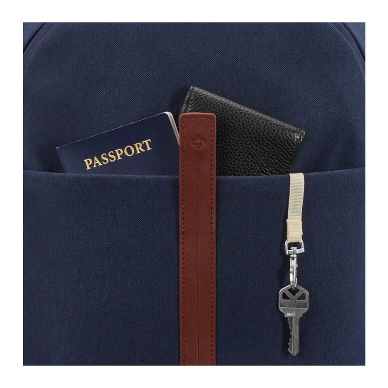 Exterior features front pocket and key fob with magnetic snap and zip closures