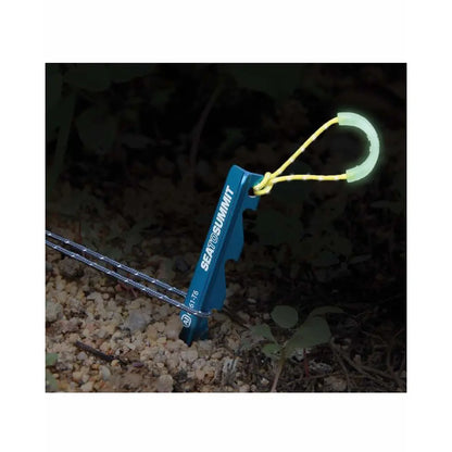 Luminescent pull loop for peg extraction; charges in sunlight, emits green glow at night
