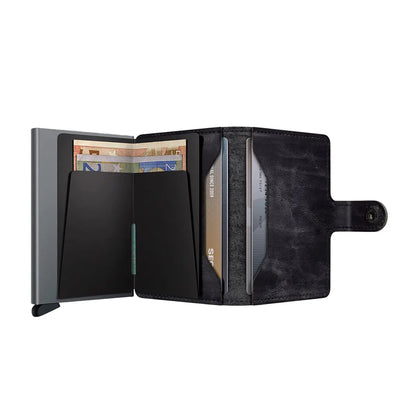 Includes two interior pockets for holding cards, notes, receipts, business cards and some coins