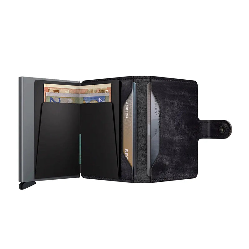 Includes two interior pockets for holding cards, notes, receipts, business cards and some coins