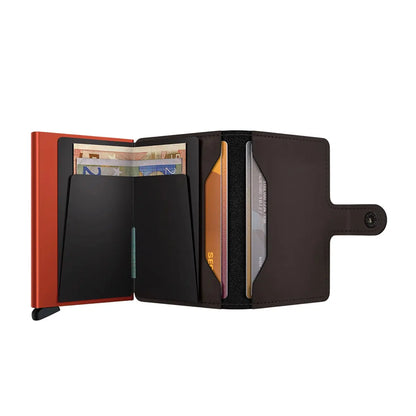 Includes two interior pockets for holding cards, notes, receipts, business cards and some coins