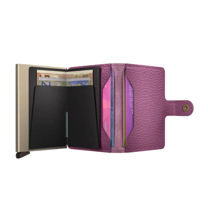 Includes two interior pockets for holding cards, notes, receipts, business cards and some coins
