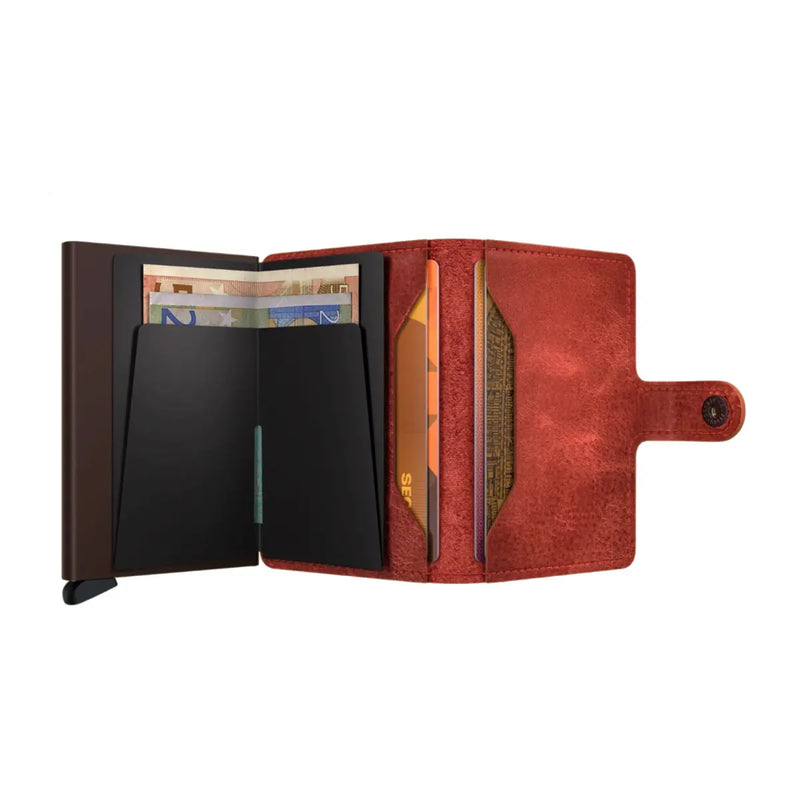 Includes two interior pockets for holding cards, notes, receipts, business cards and some coins