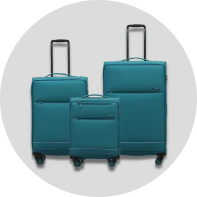 Set of three teal-colored hard-shell suitcases with black handles and green wheels.