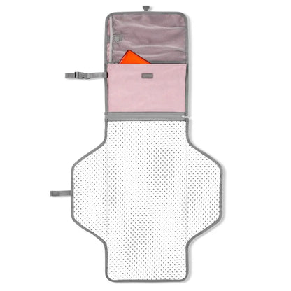 Changing pad zips off of clutch for independent use