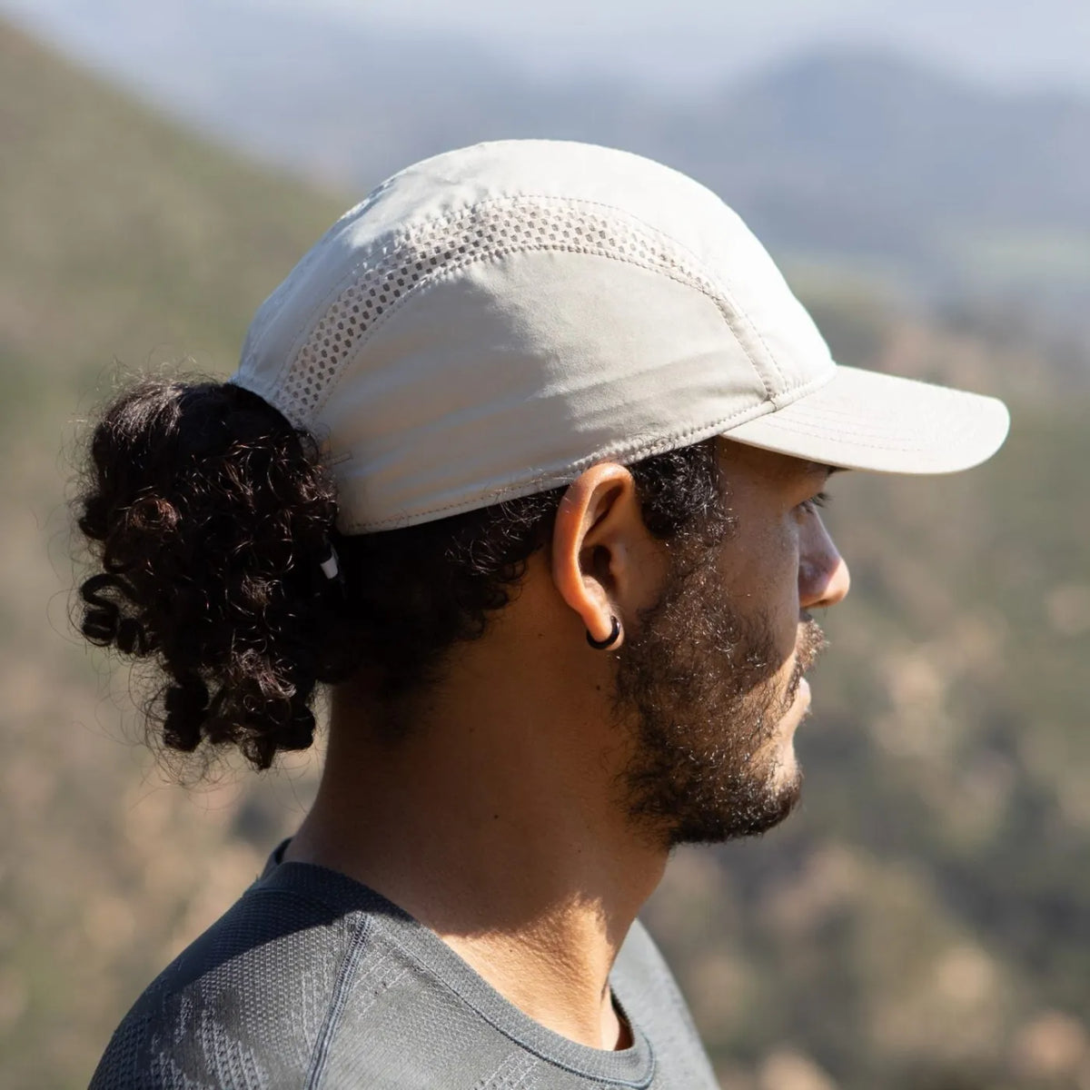 A Sunday Afternoons Aerial Sport Cap being worn outdoors