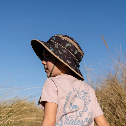 A child wearing a Sunday Afternoons Kids Fun Bucket Hat