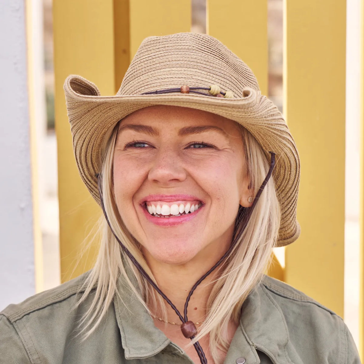 A woman wearing a Sunday Afternoons Sunset Hat