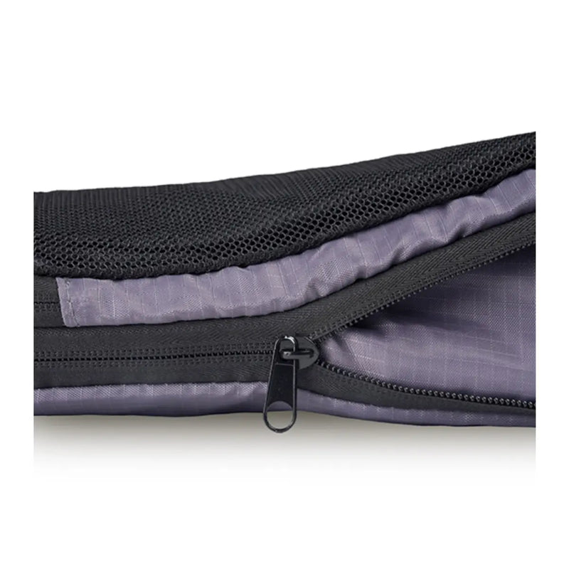 Second zipper compresses the contents of the cube